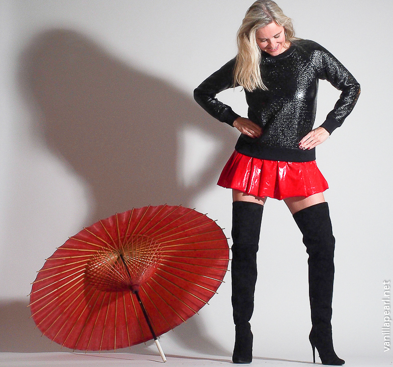 Christina, Vanilla Pearl, red vinyl skirt, black suede overknees and shiny Theory sweater
