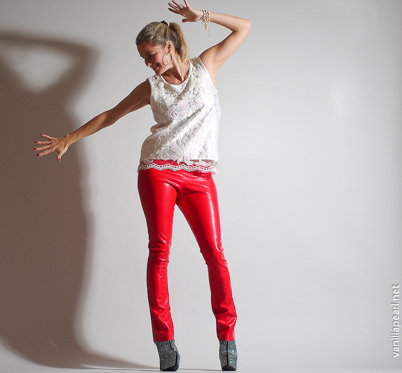 Christina, Vanilla Pearl, with red leather pants and white lace top from Arcanum Fashion